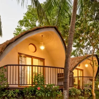 Lush tropical garden and riverfront view from Mercure Devaaya Resort, Divar Island Goa