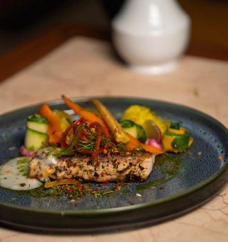 Goan seafood and fusion cuisine served at Marée, riverside restaurant at Devaaya Resort