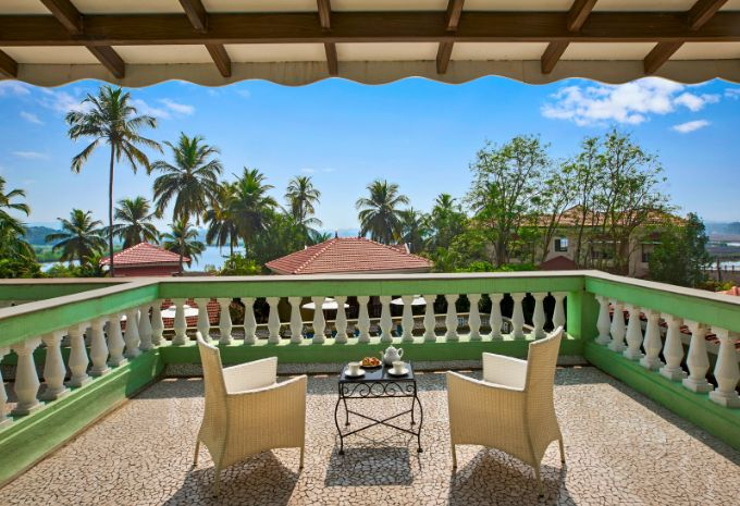 Private balcony with Portuguese balustrade and Mandovi River views at Mercure Goa Devaaya Resort Divar Island