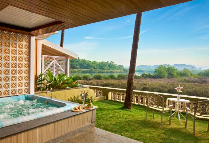 Private outdoor jacuzzi with river and paddy field views on the terrace at Mercure Goa Devaaya Resort Divar Island
